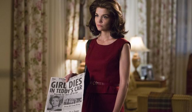 This undated image provided by ReelzChannel, shows Katie Holmes as Jackie Kennedy Onassis in the REELZ original miniseries, &amp;quot;The Kennedys-After Camelot.&amp;quot; The two hour premiere airs Sunday, April 2, 2017 at 9 p.m.ET/8 p.m. PT. Ken Woroner/(ReelzCannel via AP)