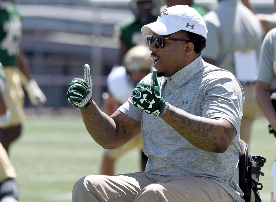 UAB fan Tim Alexander watches the team warm before the UAB's spring NCAA college football game at Legion Field in Birmingham, Ala., Saturday, April 1, 2017. UAB football returns to the field for the first time after the program was eliminated after the 2014 season. (Mark Almond/AL.com via AP)