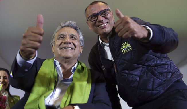 Alianza PAIS&#x27;s presidential candidate Lenin Moreno (left) and his running mate Jorge Glas smile at the end of the day of the presidential election on Sunday. (Associated Press)