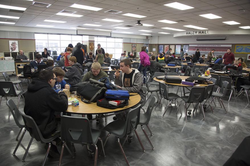 Meridian Technical Charter School students take a break for lunch Wednesday, March 8, 2017 in Meridian, Idaho. By their junior year students are studying specialized technology careers in one of four tracks. Eighty-two percent of students at MTCS go on to secondary education institutions. (Darin Oswald/Idaho Statesman via AP)