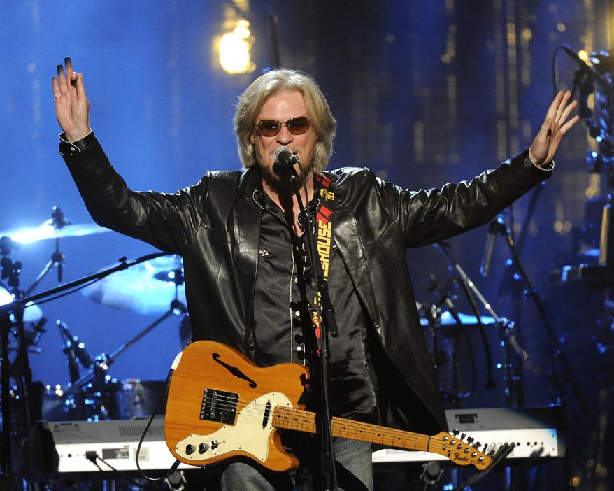 FILE - In a Thursday, April, 10, 2014 file photo, Hall of Fame Inductee, member of Hall and Otes, Daryl Hall performs at the 2014 Rock and Roll Hall of Fame induction ceremony in New York. A concert venue owned by recording star Hall is suing the New York town of Pawling, saying that measures taken to reduce the maximum legal occupancy of the site would force the business to close. A lawsuit filed March 17, 2017, seeks measures that would prevent the town from lowering the venue’s maximum occupancy from 318 standees to 198. (Photo by Charles Sykes/Invision/AP, File)