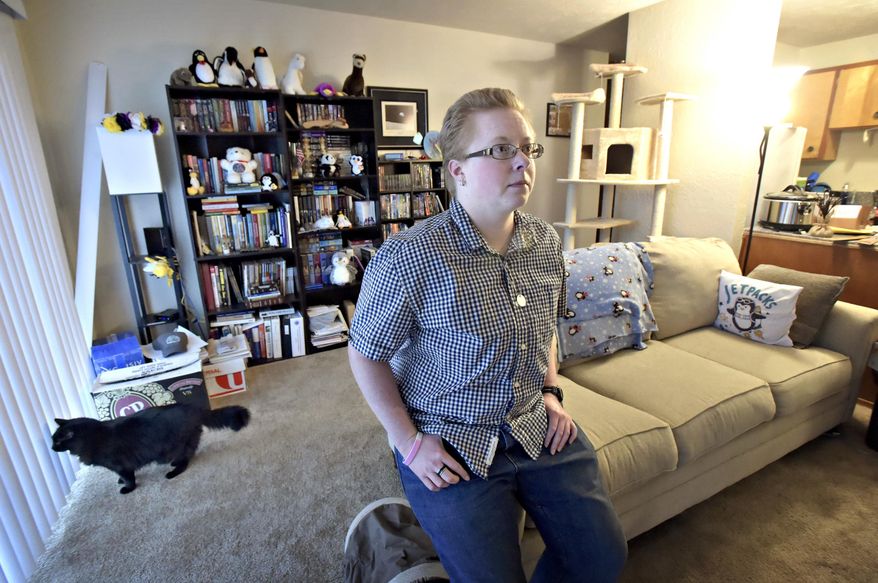 In this March 15, 2017 photo, Emory Colvin pauses in Corvallis, Ore. Colvin, whose birth name was Emily, was brought up as a girl but didn’t really identify as either male or female. Colvin filed a petition recently in Benton County Circuit Court to be declared non-binary. If the request is granted, Colvin would become the county's second non-binary resident. (Andy Cripe /The Corvallis Gazette-Times via AP)