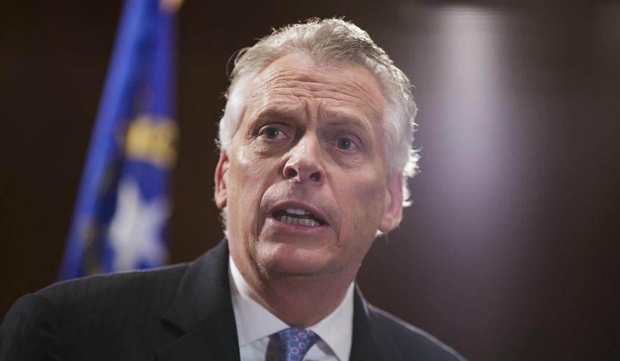 In this Feb. 27, 2017 file photo, National Governors Association (NGA) Chairman, Virginia Gov. Terry McAuliffe holds a briefing on Capitol Hill in Washington. Four former sailors who became known as the &amp;quot;Norfolk Four&amp;quot; as they fought rape and murder convictions, saying police intimidated them into falsely confessing to the crimes two decades ago have been pardoned by Gov. McAuliffe on Tuesday, March 21, 2017. (AP Photo/J. Scott Applewhite, File) **FILE**