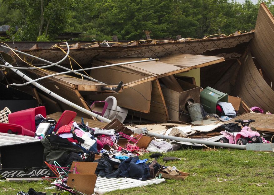 The remains of a trailer lie where a woman and her 3-year-old daughter were killed during a severe storm, in Breaux Bridge, La., Sunday, April 2, 2017. (Lucius Fontenot/The Daily Advertiser via AP)