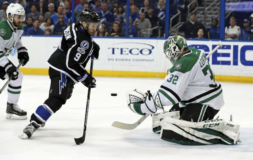 Tampa Bay Lightning&#x27;s Tyler Johnson looks for a rebound in front of Dallas Stars goalie Kari Lehtonen, of Finland, during the second period of an NHL hockey game Sunday, April 2, 2017, in Tampa, Fla. (AP Photo/Mike Carlson)