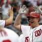 Washington Nationals pinch hitter Adam Lind (26) celebrates his two-run homer during the seventh inning of an opening day baseball game against the Miami Marlins, at Nationals Park, Monday, April 3, 2017, in Washington. (AP Photo/Alex Brandon)