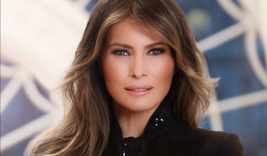 In this photo provided by the White House, first lady Melania Trump in her first official portrait as the first lady as photographed in her new residence at the White House in Washington. (The White House via AP)