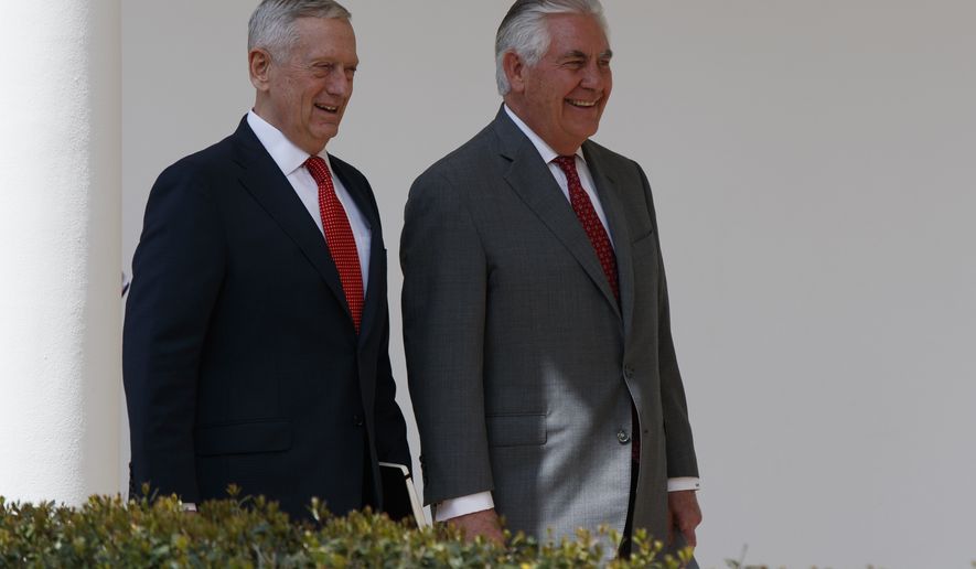 Defense Secretary Jim Mattis, left, walks with Secretary of State Rex Tillerson to a lunch with President Donald Trump and Egyptian President Abdel Fattah al-Sisi at the White House in Washington, Monday, April 3, 2017. (AP Photo/Evan Vucci)