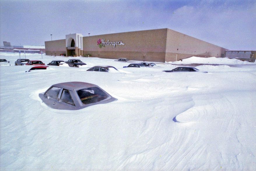 In this 1997 photo, cars are stranded at Kirkwood Mall after a blizzard in Bismarck, N.D. Tuesday, April 4, 2017, marks 20 years since the devastating April blizzard that struck North Dakota, dumping as much as 2 feet of snow in some areas. (Tom Stromme/The Bismarck Tribune via AP)