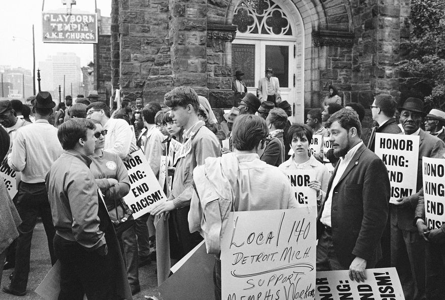 FILE - In this April 8, 1968, file photo, people gather at the Clayborn Temple as they prepare to march in honor of Dr. Martin Luther King in Memphis, Tenn., four days after the civil rights leader was assassinated. Shuttered for years, the Clayborn Temple is returning to glory as one of the most significant buildings associated with the civil rights movement in the South. (AP Photo/File)