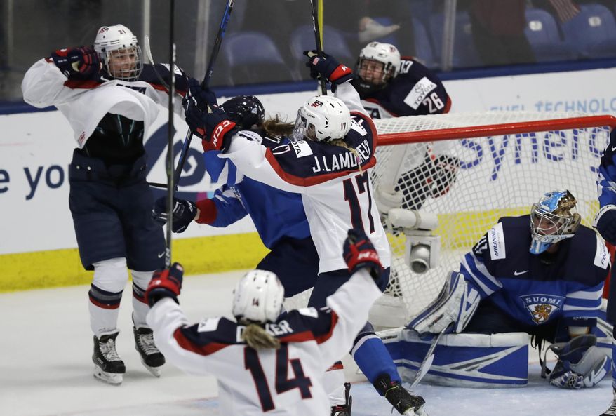 United States forward Hilary Knight (21) and teammates celebrate her goal on Finland goalie Noora Raty during the first period of a IIHF Women&#x27;s World Championship hockey tournament game, Monday, April 3, 2017, in Plymouth, Mich. (AP Photo/Carlos Osorio)