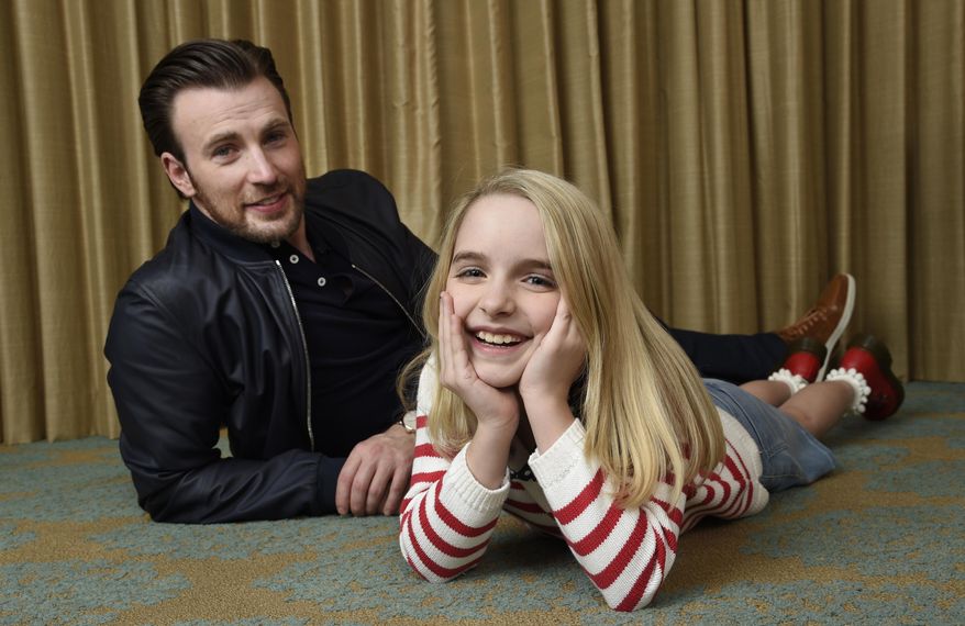 In this March 23, 2017 photo, Chris Evans, left, and McKenna Grace, cast members in the film "Gifted," pose for a portrait at the Four Seasons Hotel in Los Angeles. Evans stars as a single guy raising his math-prodigy niece, played by Grace. (Photo by Chris Pizzello/Invision/AP)