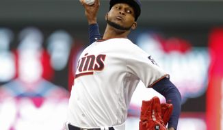 Minnesota Twins pitcher Ervin Santana throws against the Kansas City Royals in the first inning of a baseball game, Monday, April 3, 2017 in Minneapolis. (AP Photo/Jim Mone)