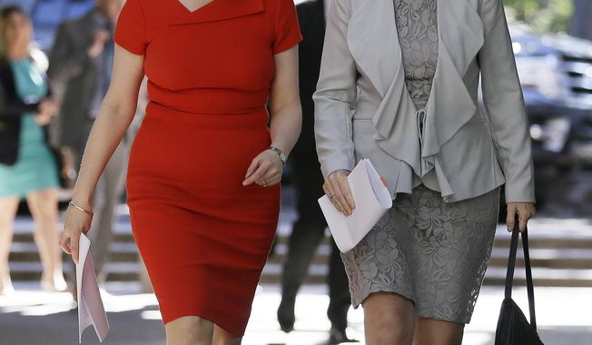 Scotland&#x27;s First Minister Nicola Sturgeon, left, walks with Lena Wilson, CEO of Scottish Enterprise, to a round table discussion at the Quadrus Conference Center Monday, April 3, 2017, in Menlo Park, Calif. Sturgeon took part in a round table discussion with angel investors led by Investing Women to help connect Scottish female entrepreneurs to US investors and vice versa. (AP Photo/Eric Risberg)