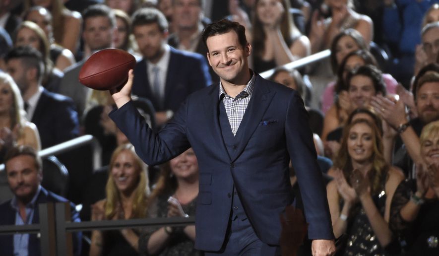 FILE - In this April 19, 2015, file photo, Tony Romo walks on stage at the 50th annual Academy of Country Music Awards at AT&T Stadium, in Arlington, Texas. A person with knowledge of the decision says Romo is retiring rather than trying to chase a Super Bowl with another team after losing his starting job with the Dallas Cowboys. The all-time passing leader for the storied franchise is headed to the broadcast booth after considering those offers. The person spoke to The Associated Press on condition of anonymity Tuesday, April 4, 2017, because Romo's decision hasn't been announced. (Photo by Chris Pizzello/Invision/AP, File)