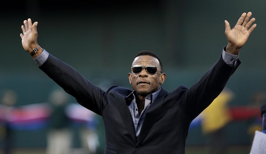 Former Oakland Athletic and Baseball Hall of Fame inductee Rickey Henderson waves to fans after a ceremony dedicating Rickey Henderson Field prior to the baseball game against the Los Angeles Angels, Monday, April 3, 2017, in Oakland, Calif. (AP Photo/Ben Margot)