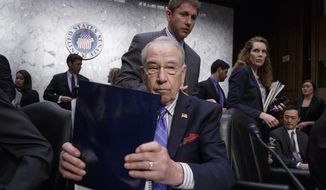 Senate Judiciary Committee Chairman Sen. Charles Grassley, R-Iowa, wraps up the meeting on Capitol Hill in Washington, Monday, April 3, 2017, after his panel voted along party lines on the nomination of President Donald Trump&#x27;s Supreme Court nominee Neil Gorsuch. (AP Photo/J. Scott Applewhite)