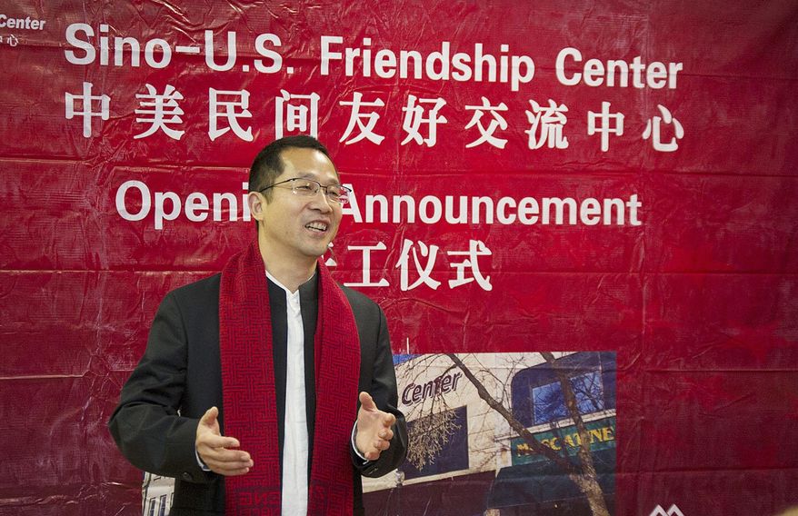 In an April 2, 2017 photo, Glad Cheng, co-owner of China Windows Group, describes what the new Sino-U.S. Friendship Center will consist of during Monday's announcement of the opening of a Sini-U.S. Friendship Center in Muscatine, Iowa. Work to convert a former furniture store in downtown Muscatine into the center is expected to begin this month. (Beth Van Zandt/Muscatine Journal via AP)
