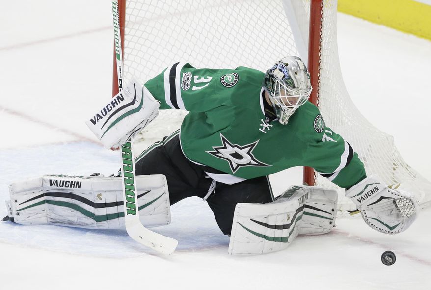 Dallas Stars goalie Antti Niemi (31) blocks an Arizona Coyotes shot during the third period of an NHL hockey game in Dallas, Tuesday, April 4, 2017. The Stars won 3-2 in overtime. (AP Photo/LM Otero)