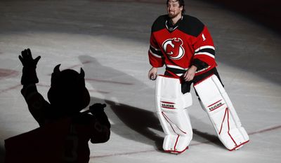 New Jersey Devils goalie Keith Kinkaid takes a curtain call after recording a 1-0 overtime win over the Philadelphia Flyers in an NHL hockey game, Tuesday, April 4, 2017, in Newark, N.J. (AP Photo/Julio Cortez)