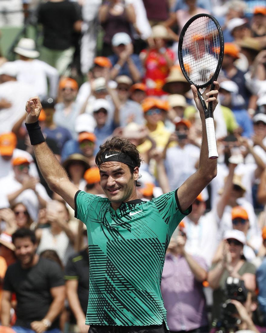 Roger Federer, of Switzerland, smiles after defeating Rafael Nadal, of Spain, 6-3, 6-4 during the men's final at the Miami Open tennis tournament Sunday, April 2, 2017, in Key Biscayne, Fla. (AP Photo/Wilfredo Lee)