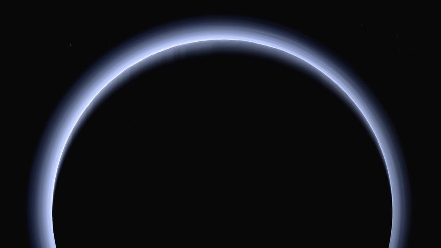 This image made available by NASA in March 2017 shows Pluto illuminated from behind by the sun as the New Horizons spacecraft travels away from it at a distance of about 120,000 miles (200,000 kilometers). On Friday, April 7, 2017, the spacecraft will reach a halfway between Pluto and its next much, much smaller stop, the Kuiper Belt object 2014 MU69. (NASA/Johns Hopkins University Applied Physics Laboratory/Southwest Research Institute via AP)