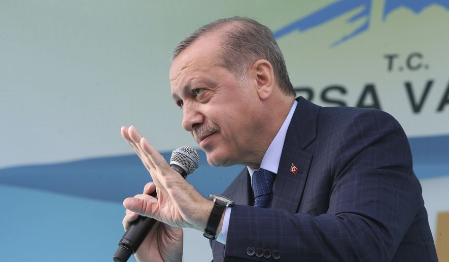 Turkey&#39;s President Recep Tayyip Erdogan addresses his supporters during a referendum rally in Bursa, Turkey, Wednesday, April 5, 2017. Erdogan has blamed a suspected chemical attack that killed at least 72 people in northern Syria on the Syrian regime and has accused the world of not speaking out against the attack. (Yasin Bulbul/Presidential Press Service, Pool Photo via AP)