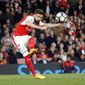 Arsenal&#x27;s Olivier Giroud shoots to score during the English Premier League soccer match between Arsenal and West Ham at the Emirates stadium in London, Wednesday, April 5, 2017.(AP Photo/Frank Augstein)