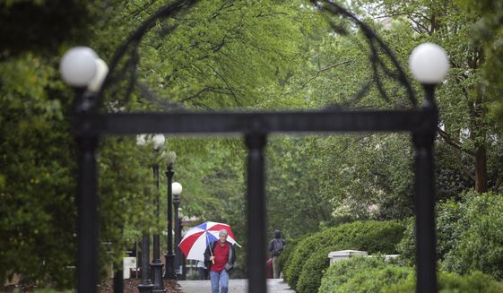 In this file photo, a man walks across the University of Georgia&#39;s North Campus in Athens, Ga. A gene that makes bacteria resistant to “last resort” antibiotics was detected in Georgia sewer water, according to an analysis run by the University of Georgia’s Center for Food Safety. (John Roark/Athens Banner-Herald via AP)  **FILE**