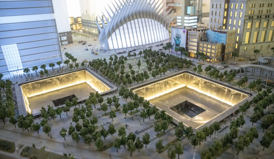 The National September 11 Memorial and the Oculus are depicted in the New York City section of the Gulliver's Gate exhibit, Wednesday, April 5, 2017, in New York. The indoor 49,000-square-foot diorama includes scale models of structures and landscapes from the Brooklyn Bridge and the Eiffel Tower to the pyramids of Egypt and China's Forbidden City, along with the Taj Mahal, Mecca, Niagara Falls and Rio de Janeiro's Christ the Redeemer statue. (AP Photo/Mary Altaffer)