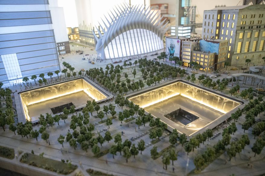The National September 11 Memorial and the Oculus are depicted in the New York City section of the Gulliver's Gate exhibit, Wednesday, April 5, 2017, in New York. The indoor 49,000-square-foot diorama includes scale models of structures and landscapes from the Brooklyn Bridge and the Eiffel Tower to the pyramids of Egypt and China's Forbidden City, along with the Taj Mahal, Mecca, Niagara Falls and Rio de Janeiro's Christ the Redeemer statue. (AP Photo/Mary Altaffer)
