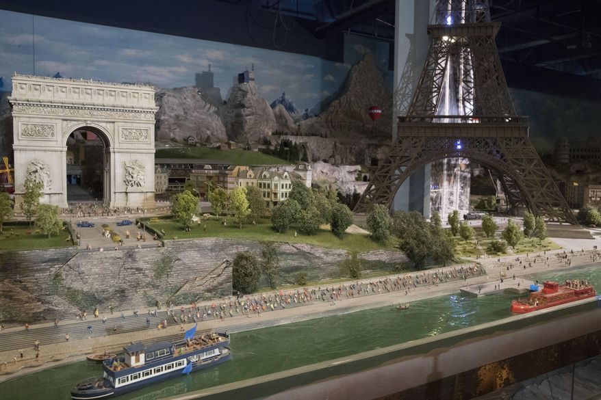 The Seine river, the Champs-Elysees, and the Eiffel Tower are depicted in the Europe section of the Gulliver's Gate exhibit, Wednesday, April 5, 2017, in New York. The indoor 49,000-square-foot diorama includes scale models of structures and landscapes from the Brooklyn Bridge and the Eiffel Tower to the pyramids of Egypt and China's Forbidden City, along with the Taj Mahal, Mecca, Niagara Falls and Rio de Janeiro's Christ the Redeemer statue. (AP Photo/Mary Altaffer)