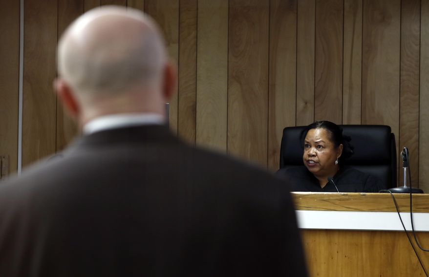 Hudson County Superior Court Judge Shelia Venable, right, speaks as John Appello, left, attorney for Michael Hansen, a Hudson County corrections officer, looks on during a hearing charging Hansen with hit and run charges, Wednesday, April 5, 2017, in Jersey City, N.J. Hansen, who was scheduled to make the appearance via a video conference but could only do it through audio because of technical difficulties, is charged with leaving the scene of an accident in which Jersey City Republican Party Chairman Russell Maffei and Marie Tauro, a prospective legislative candidate, were allegedly struck and killed April 2, 2017, while crossing a street outside a diner in North Bergen, N.J. (AP Photo/Julio Cortez)