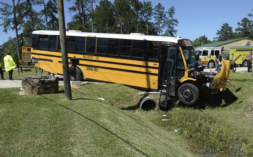 More than 20 Charlton-Pollard Elementary students and one adult were hospitalized when a Beaumont school district bus was involved in a traffic accident on U.S. 69 in Lumberton, Texas, Wednesday, April 5, 2017. The bus was taking several dozen Charlton-Pollard Elementary School students and several adults back to school from a Big Thicket field trip. Beaumont school district spokeswoman Nakisha Burns says one student was airlifted to a trauma hospital in Houston. (Guiseppe Barranco/The Beaumont Enterprise via AP)