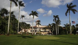 In this Nov. 27, 2016, file photo, Mar-A Lago is seen from the media van window, in Palm Beach, Fla. For a president who happens to be an expert at branding, the transformation of his Mar-a-Lago resort into the “Winter White House” is the ultimate marketing play. This week, President Donald Trump writes his members-only oceanfront property deeper into American history books by meeting there with Chinese President Xi Jinping. (AP Photo/Carolyn Kaster, File)
