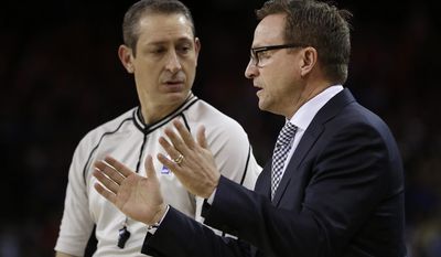 Washington Wizards coach Scott Brooks, right, gestures while speaking to a referee during the second half of the team&#39;s NBA basketball game against the Golden State Warriors Sunday, April 2, 2017, in Oakland, Calif. (AP Photo/Ben Margot)