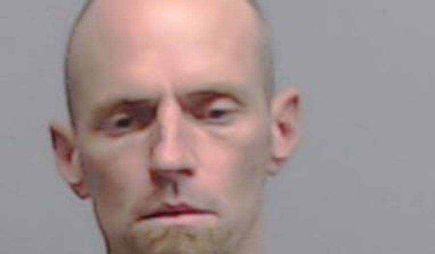 This booking photo provided by Fulton County Sheriff's Office shows Raylon Browning. Browning, accused of fatally shooting a woman on a midtown Atlanta street in broad daylight was hospitalized after jail guards found him biting his left arm and spitting blood, authorities said Wednesday, April 5, 2017. Browning was arrested in the Monday morning shooting of Trinh Hong Huynh and is also accused of stabbing two people in midtown Atlanta on Sunday. (Fulton County Sheriff's Office via AP)