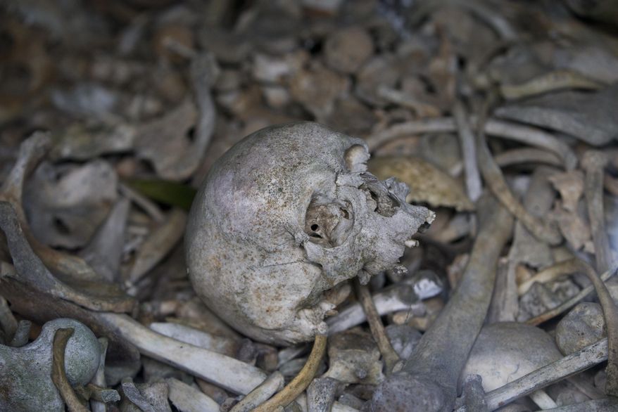 In this photo taken on April 3, 2017, the bones of soldiers are piled up in a crypt at the Douaumont Ossuary in Verdun, France. World War I saw unprecedented trench warfare in Northern France and Belgium. The toll of dead so immense in the Verdun region that soldiers from both sides were buried together in the ossuary. (AP Photo/Virginia Mayo)