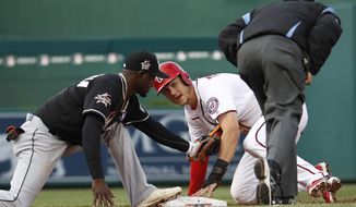Washington Nationals&#39; Trea Turner (7) looks for the call after stealing second against Miami Marlins second baseman Dee Gordon (9) during the third inning of a baseball game in Washington, Thursday, April 6, 2017. (AP Photo/Manuel Balce Ceneta)