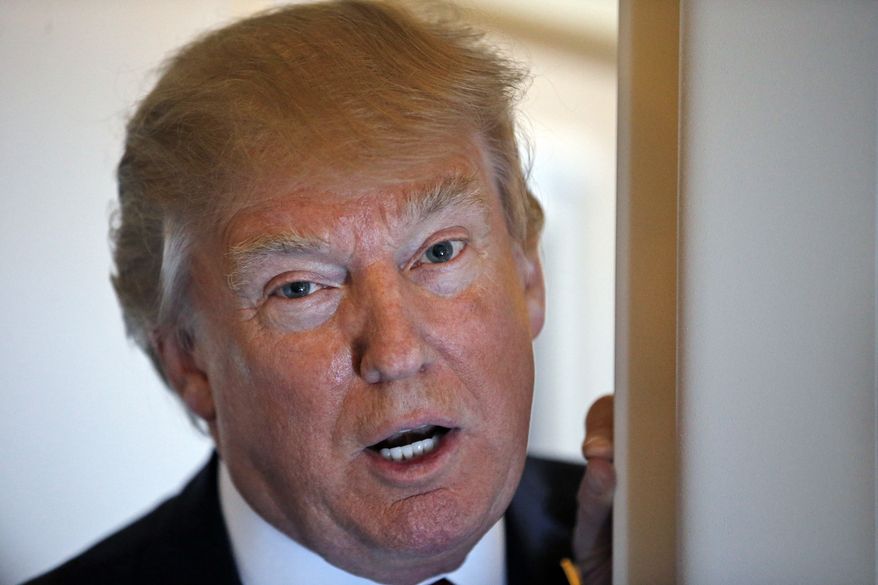 President Donald Trump speaks with reporters on Air Force One while in flight from Andrews Air Force Base, Md., to Palm Beach International Airport, Fla., Thursday, April 6, 2017. (AP Photo/Alex Brandon)