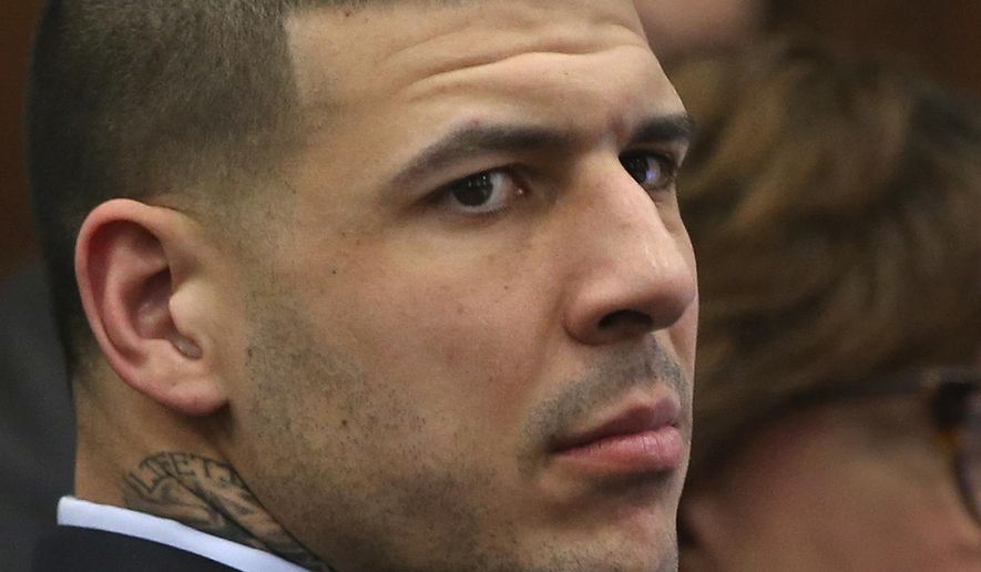 Former New England Patriots tight end Aaron Hernandez listens to testimony during his double murder trial in Suffolk Superior Court in Boston, Wednesday, April 5, 2017.  Hernandez is standing trial for the July 2012 killings of Daniel de Abreu and Safiro Furtado, who he encountered in a Boston nightclub. The former NFL player is already serving a life sentence in the 2013 killing of semi-professional football player Odin Lloyd.  (Nancy Lane/The Boston Herald via AP, Pool)
