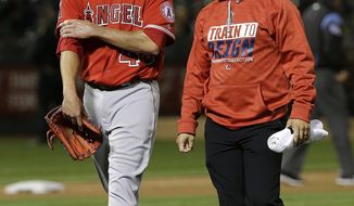 Los Angeles Angels pitcher Garrett Richards, left, leaves the field with a trainer after being relieved during the fifth inning of the team&#39;s baseball game against the Oakland Athletics in Oakland, Calif., Wednesday, April 5, 2017. (AP Photo/Jeff Chiu)