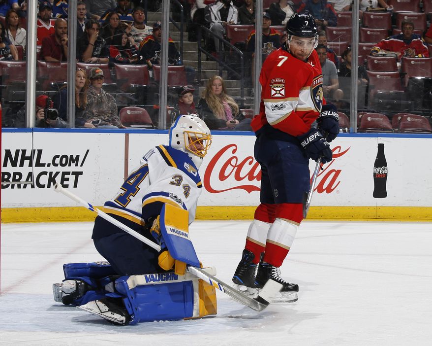 Florida Panthers center Colton Sceviour (7) looks back as St. Louis Blues goaltender Jake Allen (34) blocks his tip in attempt during the first period of an NHL hockey game, Thursday, April 6, 2017, in Sunrise, Fla. (AP Photo/Joel Auerbach)