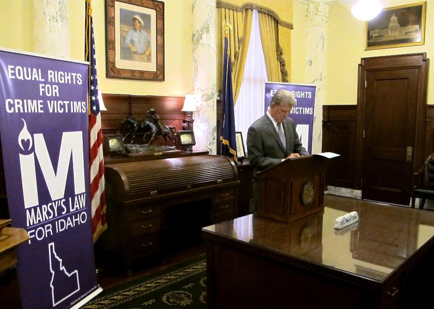 Idaho Gov. C.L. "Butch" Otter signs a proclamation dedicating April 2 through April 8 "Crime Victims' Rights Week" in Boise, Idaho Thursday, April 6, 2017. Senate Majority Caucus Chair Todd Lakey said Thursday he will bring back his proposal during the 2018 legislative session after his first version was spiked by a House committee earlier this year. The proposal would have required that crime victims be notified of all court proceedings and be heard at each step along the way. It also would have declared that full and timely restitution is a right. (AP Photo/Kimberlee Kruesi)