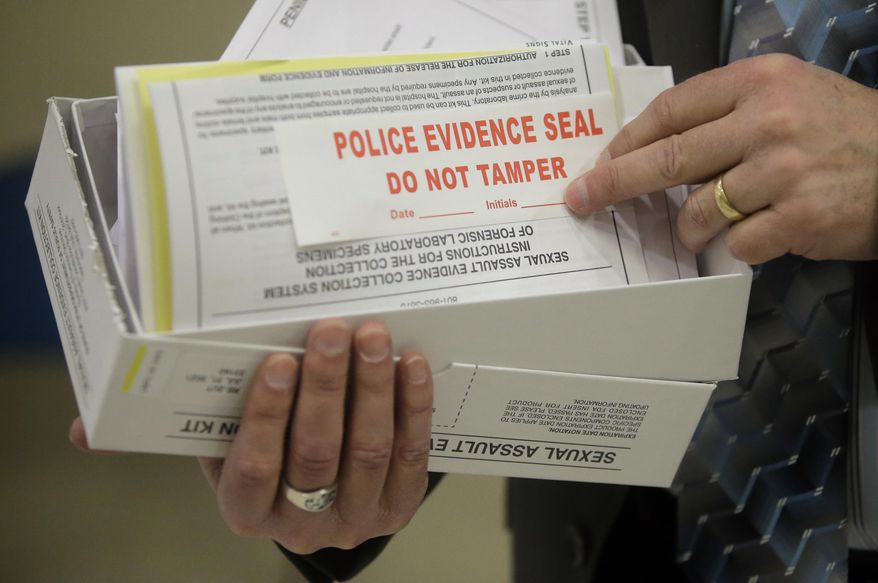This Feb. 8, 2017, photo, Utah State Crime Lab Director Jay Henry holds a sexual assault evidence collection kit following a committee meeting at the Utah State Capitol, in Salt Lake City. Utah crime lab officials are feeling optimistic as they work to speed up the time it takes to process sexual assault evidence kits, after lawmakers approved a measure last month that sends more than $1 million to go toward this effort. (AP Photo/Rick Bowmer)