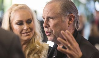 FILE - In a Saturday, March 25, 2017 file photo, Todd Fisher and Catherine Hickland, left, arrive at the Carrie Fisher and Debbie Reynolds Memorial Service at The Forest Lawn, in Los Angeles. Fisher considers himself the custodian of Debbie Reynolds’ and Carrie Fisher’s legacies. (Photo by Willy Sanjuan/Invision/AP, File)