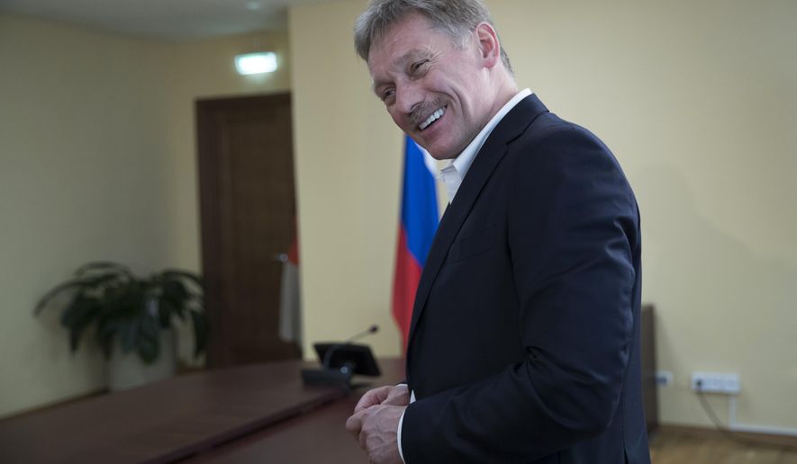 President Vladimir Putin's spokesman Dmitry Peskov speaks with The Associated Press in Moscow, Russia, Thursday, April 6, 2017. (AP Photo/Pavel Golovkin)