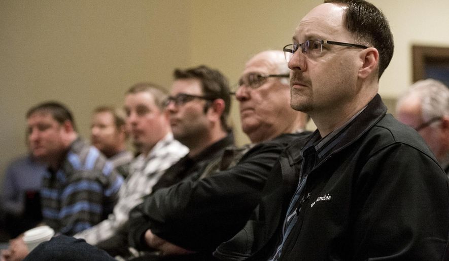 Owners of Whiteclay's four beer stores listen to testimony before the Nebraska Liquor Control Commission during a hearing regarding alcohol sales in Whiteclay, Neb., on Thursday, April 6, 2017, at the Nebraska Capitol in Lincoln, Neb. The stores in Whiteclay are blamed for rampant alcoholism on the neighboring Pine Ridge Indian Reservation in South Dakota. (Kristin Streff/The Journal-Star via AP, Pool)