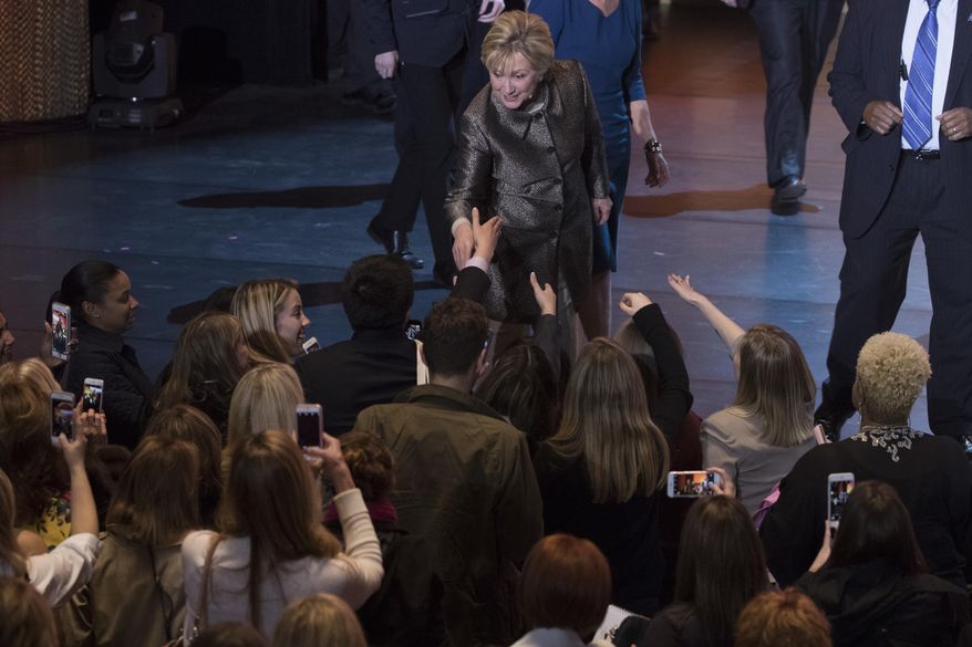 Former Secretary of State Hillary Clinton greets members of the audience after speaking at the Women in the World Summit at Lincoln Center in New York, Thursday, April 6, 2017. (AP Photo/Mary Altaffer)