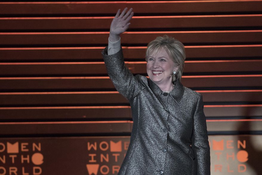 Former Secretary of State Hillary Clinton waves at the audience as she arrives at the Women in the World Summit at Lincoln Center in New York, Thursday, April 6, 2017. (AP Photo/Mary Altaffer)